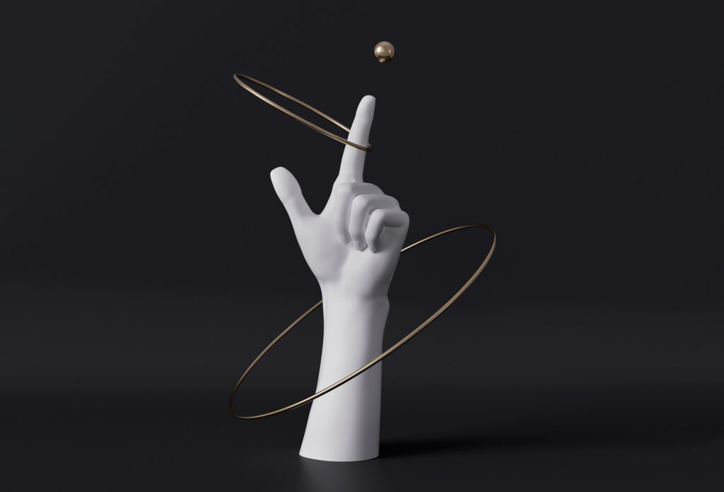 Zwei Reifen kreisen um eine Hand die auf eine Kugel zeigt. Das Bild ist ein Symbol für das erarbeiten einer Markenpositionierung.